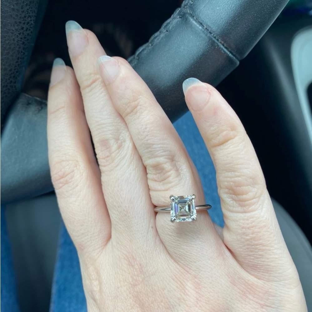 Pre owned lab grown asscher cut diamond ring.